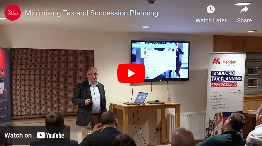 Graham Loosley giving a Tax Talk presentation to a group of people.