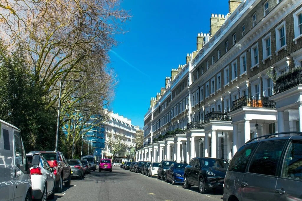 Cars parked on a street in London, incorporating tax benefits.