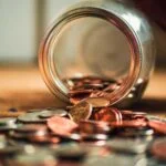 Inheritance Tax (IHT) Receipts by HMRC Up 18% Since 2022 7 Jar with money pouring out