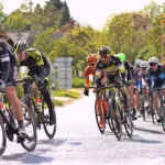 Pedal Your Way to Tax Savings: The Cycle to Work Scheme for Limited Companies 15 A group of cyclists pedaling down a road while taking advantage of the Cycle to Work Scheme for tax savings.