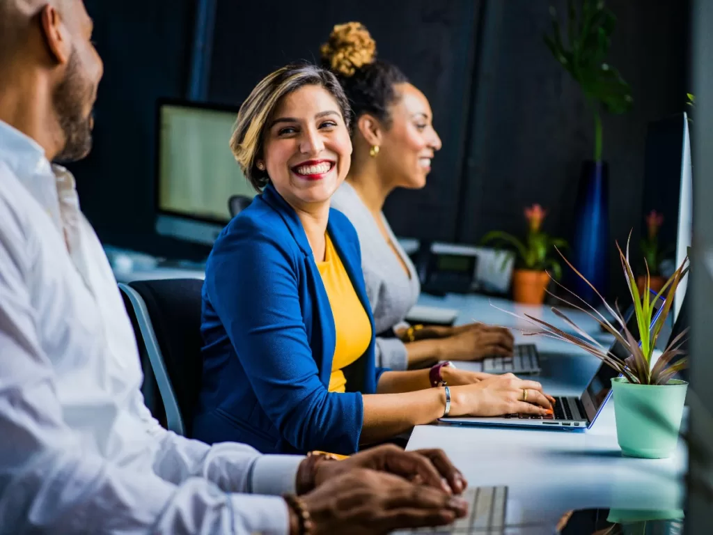 Tax-Efficient Benefits for Employees 1 Colleagues at desk with laptops