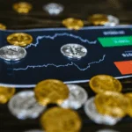 HMRC's New Campaign: A Closer Look at Crypto Tax Compliance 3 A stack of gold coins on a table next to a bitcoin chart, highlighting Crypto Tax Compliance.