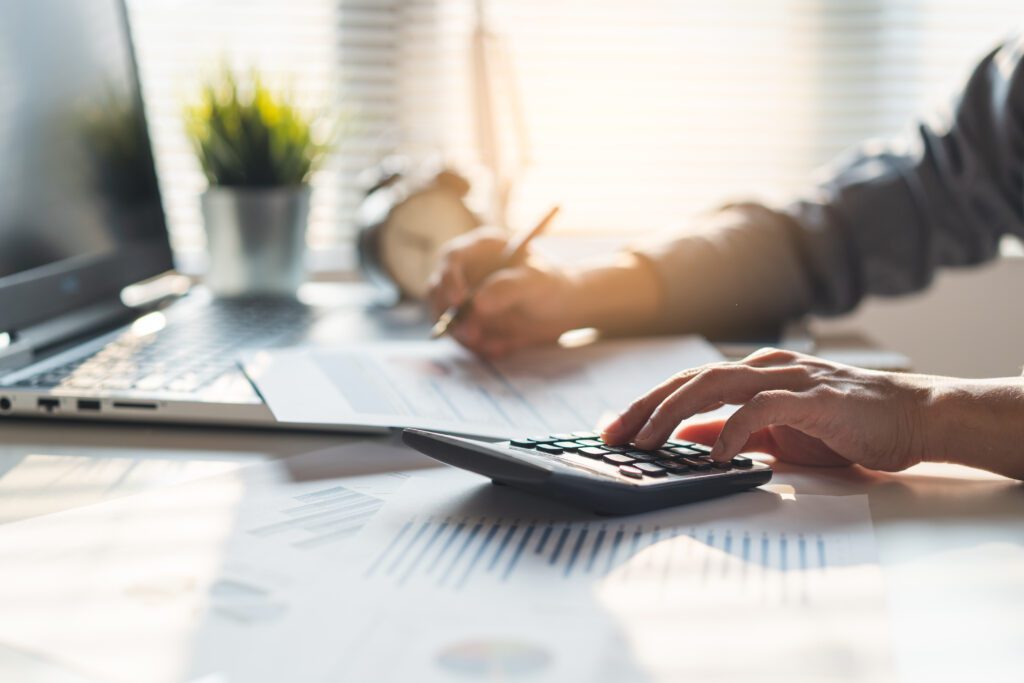 October 2026 Newsletter 2 Tax deduction planning concept. Businessman calculating business balance prepare tax reduction.
