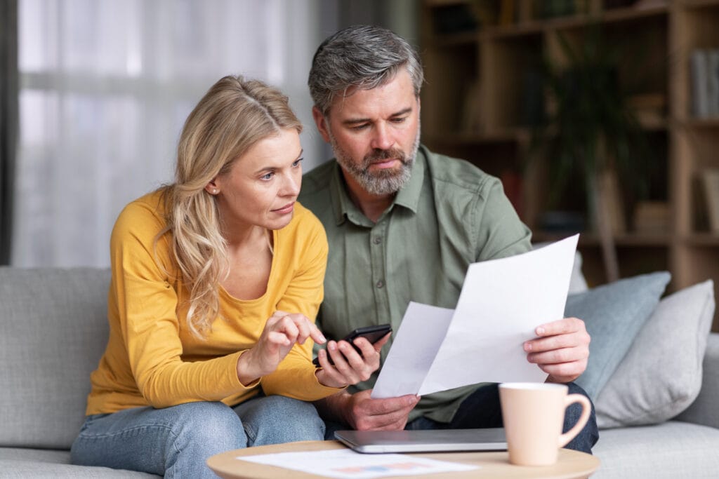 What the Budget Could Mean for Your Money: Six Big Tax and Finance Changes to Watch 3 Married Middle Aged Couple Planning Budget Together