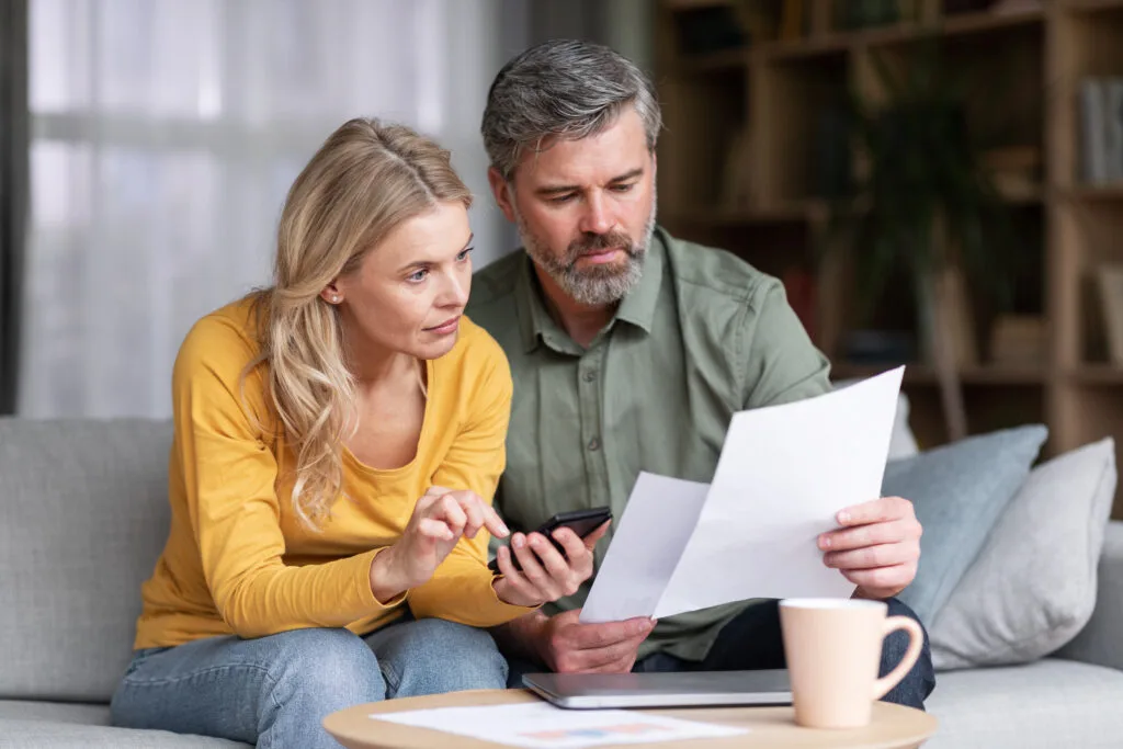 What the Budget Could Mean for Your Money: Six Big Tax and Finance Changes to Watch 3 Married Middle Aged Couple Planning Budget Together