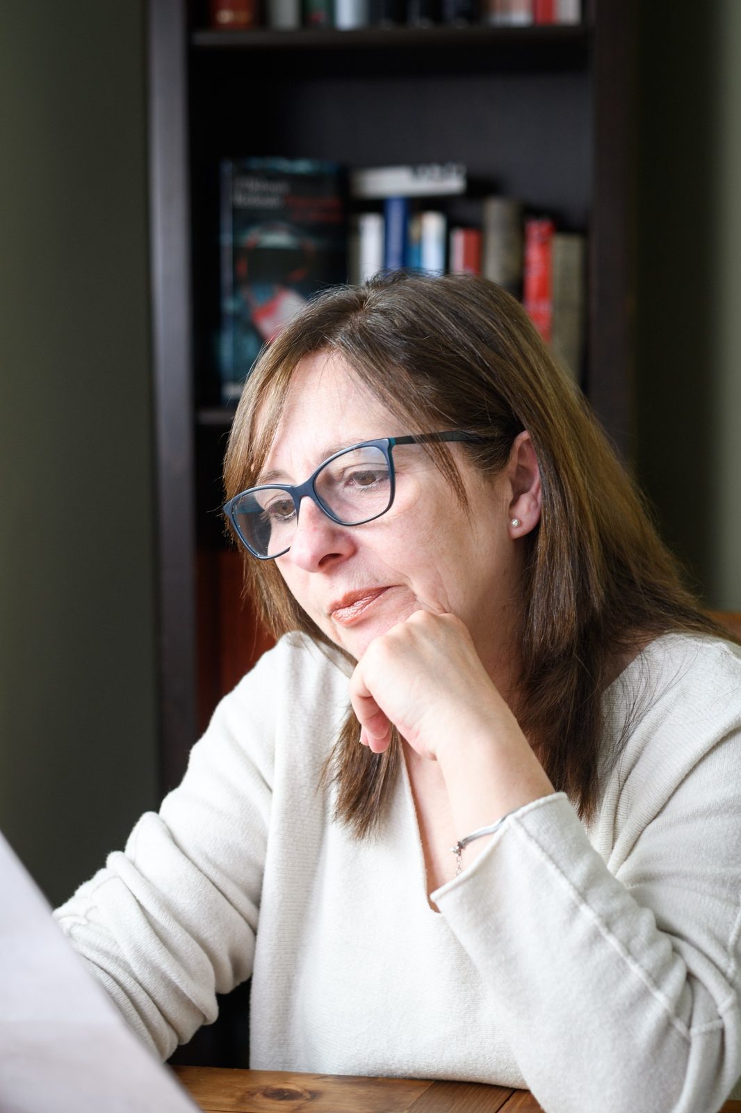 Annual Estate Update 1 Senior woman thinking while reading a document