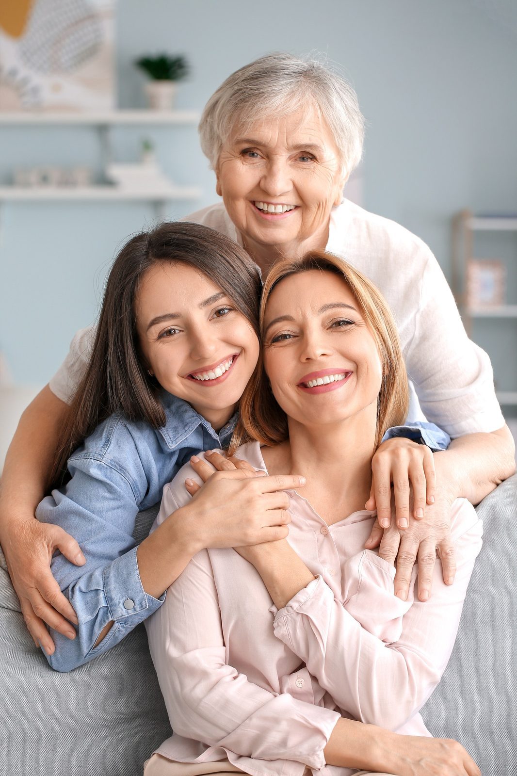 Lifetime Gift Report 1 Mature woman with her adult daughter and mother spending time together at home