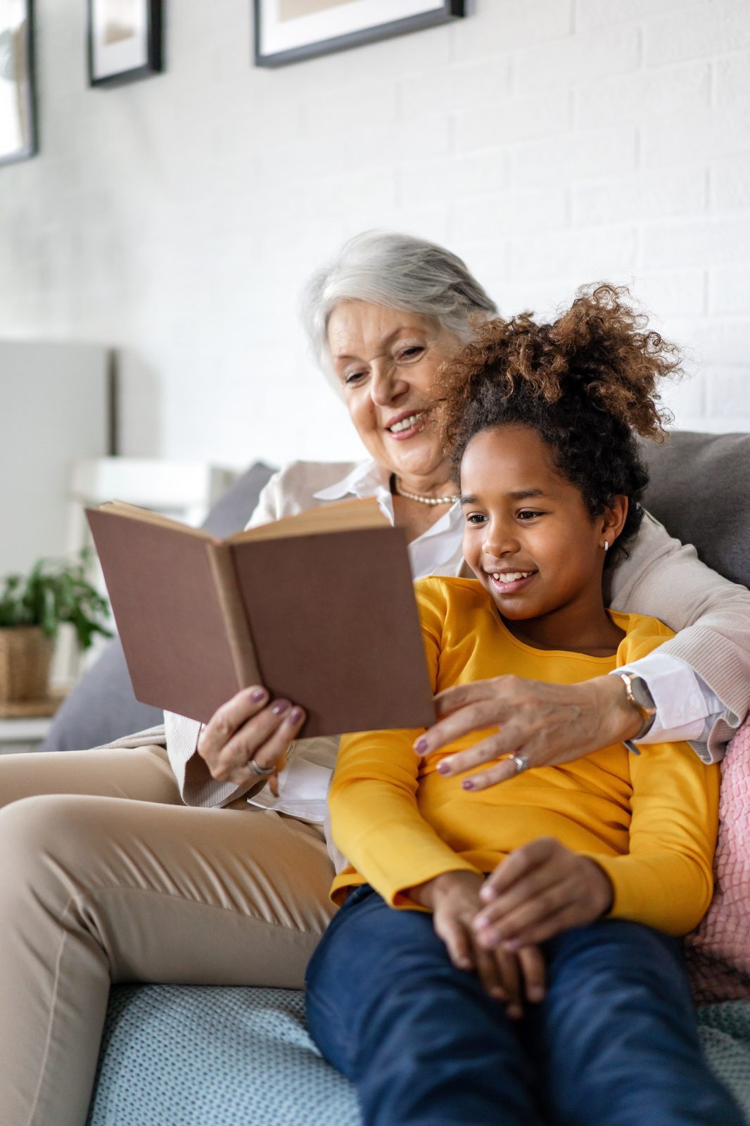 Regular Gifting Report 1 Grandmother studying with her grandchildren for school